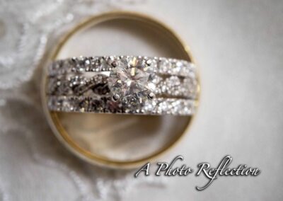 A Photo Reflection Logo Contains wedding bands and diamond ring Contains text A Photo Reflection
