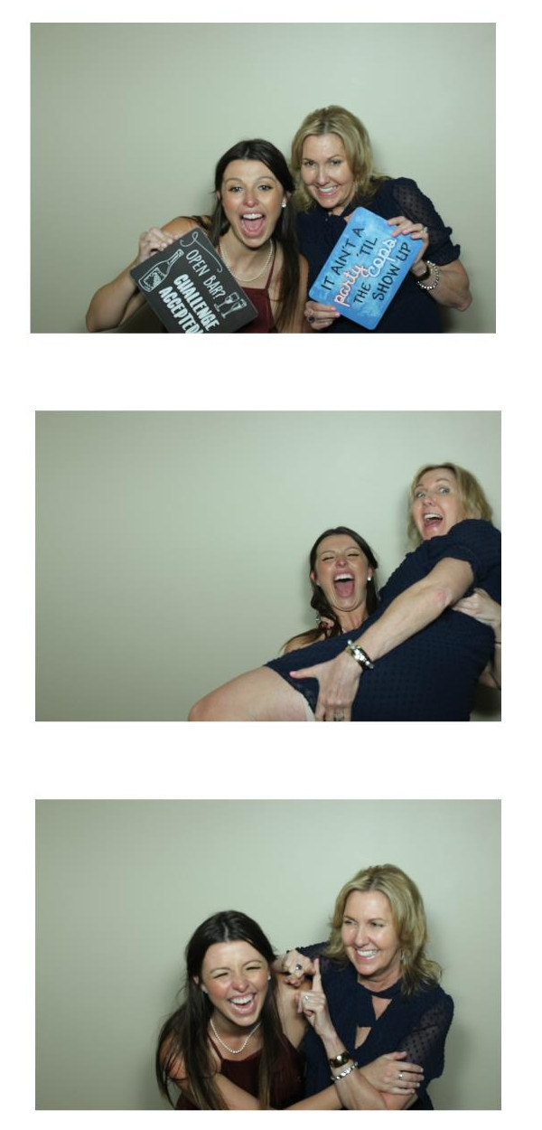 Two Co workers having a blast using the Open Air Photo Booth